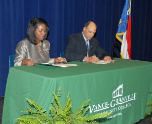 From left, Dr. Stelfanie Williams, the president of Vance-Granville Community College, and Harold L. Martin Sr., the chancellor of North Carolina A&T State University, sign the RN to BSN articulation agreement between the two institutions at a ceremony held in the VGCC Civic Center on Feb. 8. (VGCC photo)