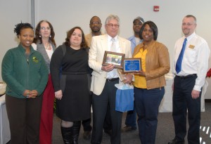 Students and faculty members from the VGCC chapter of Phi Beta Lambda honored Bobby Van Brunt during his retirement reception; in front, from left: student Ruthie Davis, chapter president Theresa Chiplis, Bobby Van Brunt, chapter adviser LaTonya Steele and co-adviser Carl Hann; in back, from left: chapter vice president Diane Power, co-adviser Delton Farmer and VGCC graduate/professional division member Lonnie Brame. (VGCC photo)