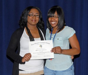 From left, VGCC women’s volleyball Coach Heather Chance presents an award to player Brittny Shells. (VGCC photo)
