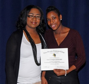 From left, VGCC women’s volleyball Coach Heather Chance presents an award to player Velvanique Seward. (VGCC photo)