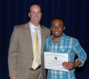 From left, VGCC men’s basketball Coach Mike Rotolo presents an award to player Larry Mote. (VGCC photo)