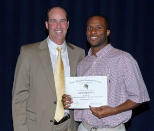 From left, VGCC men’s basketball Coach Mike Rotolo presents an award to player Shawn Brown. (VGCC photo)