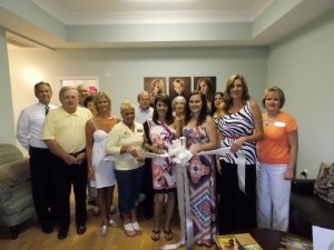 Shown at the Henderson-Vance Chamber of Commerce ribbon cutting for Nancy Jo Photography, are, from left, front row: Mike Rainey, City Tire; Julia Langston, Henderson Family YMCA; Clareese Moss, New You with Shortcake; Nancy Jo Smith, Owner/Photographer; Jennifer Woodlief, Photographer; Angie Butts; second row: John Barnes, Henderson-Vance Chamber of Commerce President; Wayne Kinton, Consolidated Marketing; Debbie Kinton, Consolidated Marketing; Charles Parham, Home Decorator Shoppe; Louise Parham, Home Decorator Shoppe; Stephanie Walker; Sheri Jones, Chamber Communications Consultant.