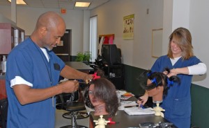 Students (from left) Thomas Hunt and Kaley Woods train in the Cosmetology lab at VGCC’s South Campus in Granville County. (VGCC photo)