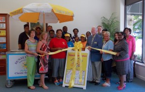 Shown at the Henderson-Vance Chamber of Commerce ribbon cutting for Sunset Slush Classic Ice of North Raleigh, are, from left, front row: Jenny Hester, Prim Development and Rentals; Marylaura McKoon, Zeb Vance Elementary School; Emily McCormick, Owner; Batrice Brown, Sunset Slush; Patricia Brown, Kelly Brown, Sunset Slush; Pete O’Geary, Mayor; Clareese Moss, New You with Shortcakes; Bernice Bullock, Generations Community Credit Union; second row: Connie Ragland, Work First Coordinator; Roberta Freeman, Henderson-Vance Chamber of Commerce Office Manager; John Barnes, Henderson-Vance Chamber of Commerce President; Sharon Barnette, Faith Moving Forward; Ron Judkins, Trinity Bail Bonds; Geraldine Brown; Tilda Hendricks, Hendricks Insurance; Phil Hart, Data Forge; Twanna Jones, ACT’s; Aide Nonato; Jasmine Hightower, VGCC.  Also attended but not pictured: (Tommy Hester, Chair, Vance County Board of Commissioners; Annette Roberson, Director of Membership.