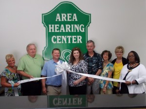 Shown at the Henderson-Vance Chamber of Commerce ribbon cutting for Area Hearing Center, LLC, are, from left, Clareese Moss, New You with Shortcake;  Mike Rainey, City Tire; Brandon Gray, Area Hearing Center; Lara “Kotty” Gray, Doctor of Audiology & Owner; . Tommy Hester, Chair, Vance County Board of Commissioners; Jenny Hester, Prim Development; Annette Roberson, Membership Director, Henderson-Vance County Chamber of Commerce; Freda Hawley, Walmart Distribution Center.