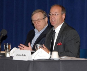 Todd Wemyss (right), site manager for Glen Raven in Norlina, speaks during a community forum organized by N.C. State’s Institute for Emerging Issues on the future of manufacturing and workforce development at the VGCC Civic Center on July 18, 2013. Listening at left is George Rusincovitch of Vescom. (VGCC photo)