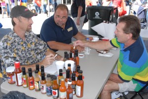 From left, VGCC Culinary Arts student Randy Wilfong of Henderson, program head Chef Ross Ragonese and student Tom Schmuker of Creedmoor taste sauces and compare notes while serving as judges at the seventh annual North Carolina Hot Sauce Contest in Oxford on Sept. 14, 2013