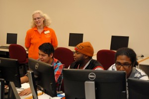From left, VGCC Computer Education instructor Yolanda Yoder oversees students, including Alberto Ortiz of Henderson, B.K. Hall of Oxford, and Damian Maldonado of Henderson, in a computer lab on the college’s Main Campus. (VGCC photo)