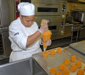 VGCC Culinary Arts student Terri Pulley of Louisburg prepares mashed sweet potatoes for a Vanguard Café lunch. (VGCC Photo)