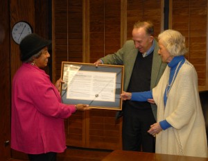 Deborah Brown, Chair of the VGCC Board of Trustees, left, presents a framed resolution from the board honoring the memory of Charles F. Blackburn to Mr. Blackburn’s wife, Jane Blackburn, right, and her nephew, Tem Blackburn. Charles Blackburn was the college’s first chairman of the trustee board. The Trustees made the presentation at their regular bimonthly meeting on Main Campus on Monday, Jan. 28. (VGCC photo)