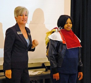 Kate Leser (left) demonstrates different colors with the help of VGCC student Lashamika Ragland of Henderson. (VGCC photo)