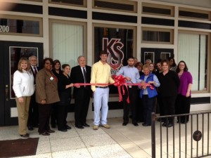 Shown at the Henderson-Vance Chamber of Commerce ribbon cutting for KO’s Sports Grille are, from left: Chamber Board Member & Ambassador Susan Rogers, Chic-fil-A; Chamber Ambassador Michael Bobbitt; Chamber Ambassador Sandra White, Saint Augustine’s University; Mayor Pro Tem Mike Rainey, City Tire; Bradley Scott, KO’s Manager; Kaiser Hauter, Owner; Chamber Ambassador Clareese Moss, New You with Shortcakes; John Barnes, President Henderson-Vance Chamber of Commerce; Board Member Mel Manning, Quality Investments; Connie Ragland, Work First Coordinator; Melanie Mann, Chamber Office Manager and KO’s Sports Grille staff.  (Attended but not pictured) Annette Roberson, Director of Membership Services.