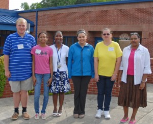 Dabney Elementary School Assistant Principal Cheryl Coplin (third from left) greeted volunteers organized by VGCC and helped train them as proctors. Pictured with Coplin, from left, are Appalachian State University student Grant Woltz of Henderson, VGCC students Nikkiya Carroll of Henderson, Megan Sullivan of Oxford and Brandy Pendergrass of Henderson, and VGCC graduate Ellen Williams of Henderson. All of the current VGCC students were School-Age Education majors, and Sullivan graduated with that degree on May 16. Sullivan and Pendergrass were returning to Dabney after completing their internships at the school. (VGCC photo)