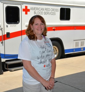 Tessa Egan is seen here in front of the “Bloodmobile” during the drive that she coordinated on VGCC’s Main Campus. (VGCC photo)