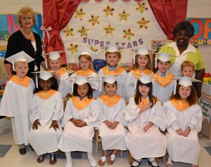 The 2014 graduates of the Vance-Granville Community College Child Care Center included, seated, from left: Nakiyah Dunston, Mya Thompson, Carson Rowan, Annabel Willey and Kylie Stainback; and standing, from left, Willard Medlin, Michelle Hunter, Kaylee Overby, Owen Beal, Mia Monroe, Benjamin Waters and marshal Aiden Duke. Standing in back are (left) Child Care Center manager Denise Gill and (right) teacher Deborah Harris. (VGCC Photo)