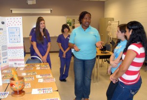 VGCC Pharmacy Technology students and program head Dr. Erica Fleming (center) talk with Mini-Medical School students in a classroom at the college’s South Campus. (VGCC photo)
