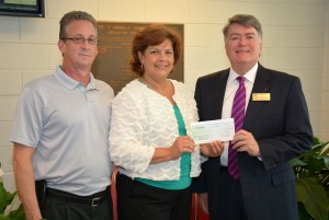 From left, Dwight Green of Henderson, general manager for J.P. Taylor Company, and Vanessa Smith of Wilson, vice president of human resources for Universal Leaf North America (which has facilities in Granville and Nash counties), present contributions creating the new scholarships to VGCC Endowment Director Eddie Ferguson. (VGCC photo)
