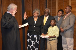 Chief District Court Judge Daniel Finch of the Ninth Judicial District administers the oath to Vance-Granville Community College's newest trustee, Barbara Cates Harris, on Monday evening at the board's regular meeting. From left are Judge Finch; Mrs. Harris; Phillip Harris, her husband; Maurice Harris Jr., their grandson; Brenda Harris, daughter-in-law; and Maurice Harris Sr., son. (VGCC photo)
