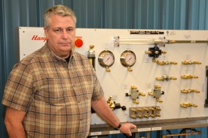 VGCC Mechatronics Engineering Technology Program Head/instructor Keith Shearon is seen here with a hydraulic trainer at the college’s South Campus. (VGCC photo)