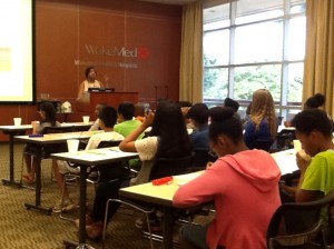 VGCC Pharmacy Technology program head Dr. Erica Fleming (standing) addresses students during a workshop at the Andrews Center on the main campus of WakeMed in Raleigh.