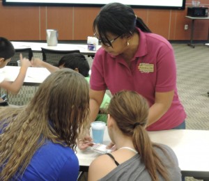 VGCC Pharmacy Technology instructor Brenda Harvey helps students with a hands-on exercise during a workshop at the Andrews Center on the main campus of WakeMed in Raleigh.