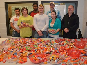 VGCC Criminal Justice Club members packed bags of Halloween candy for area senior citizens. Students included, from left, on front row, Benjamin Layton of Kittrell, Joseph Toto of Oxford, Yancey Otero of Oxford and Paul Grenier of Oxford; from left, on back row, William Douglas of Henderson, Kendrick Gregory of Henderson and William Nutt of Henderson. (VGCC photo)