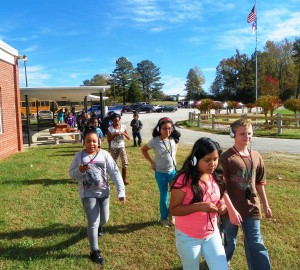 Fifth graders at Carver Elementary School begin one of their “Walking Classroom” sessions.