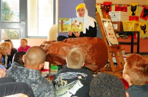 Principal Anne Garrison wears the eagle outfit she made as she reads to some of her students at Zeb Vance Elementary School on November 12.