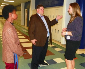 Dr. Larry Webb, principal of Eaton-Johnson Middle School, is joined by Assistant Principal Cheryl Coplin, left, as he talks about his school with Dr. Carrie Tulbert, 2014-2015 N.C. Principal of the Year.