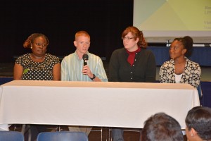 VGCC student panelists (from left) Rosemary Ombajo, Dakota Parrish (holding microphone), Victoria Anderson and Imani Burwell answer questions from local middle and high school counselors and administrators at the Oct. 23 forum in the VGCC Civic Center. (VGCC Photo)
