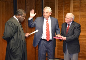 District Court Judge J. Henry Banks Jr. of the Ninth Judicial District administers the oath of office to Vance-Granville Community College's newest trustee, Dwight Frazier of Henderson, on Monday evening at the board's regular meeting. From left are Judge Banks, Dwight Frazier and fellow trustee L. Opie Frazier, Jr., also of Henderson. The Fraziers are first cousins. (VGCC photo)