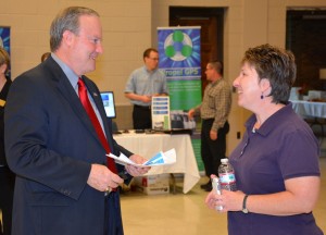 From left, Richard “Rick” Burtner, president and CEO of Propel GPS, talks with Janet Meyer of Oxford, owner of “A Sharper Shear” and a Small Business Summit/Expo attendee. (VGCC photo)