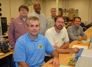 The first meeting of the newly renamed VGCC Engineering Advisory Committee was held Oct. 28 in the Electronics lab on the college’s Main Campus. Members include, seated from left, Shawn Nutter, Manufacturing Controls and Project Engineering Manager at Revlon in Oxford; Joey Bailey, Senior Manufacturing Engineer from Corning Life Sciences in Durham; and Don Bowman, Engineering Manager for Wake Electric in Youngsville. Standing, from left, are VGCC Applied Technologies department chair Wesley Williams, TAACCCT grant project manager Kenneth Wilson and Mechatronics Engineering Technology program head/instructor Keith Shearon. Other members of the committee not pictured are Tewonn “Mike” Brown of Procter and Gamble Pet Care, David Martin of Bridgestone/Bandag and Crystal Weaver of Onin Staffing. (VGCC photo)