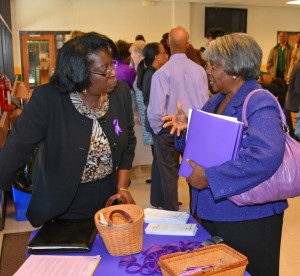 From left, Karen Branch of Infinite Possibilities talks with VGCC Human Services Technology student Eunice Parker of Roxboro during the Domestic Violence Awareness event at the college’s Main Campus. Parker completed her work-based learning course at Safe Haven, a domestic violence agency in Person County, and recently took the state certification exam to become a victims’ advocate. (VGCC Photo)