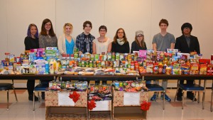 The VGCC History Club poses with items donated during their recent food drive, before delivering them to the Food Bank of Central and Eastern North Carolina. Pictured, from left: students Amanda Richardson of Warrenton and Jessie Hartley of Oxford, instructor/club advisor Victoria Klesmith, students Morgan McFalls of Oxford and Jennifer Burns of Henderson, instructor/club advisor Natasha Thompson, and students Stephanie Hommel of Youngsville, Taylor Abbott of Kittrell and Justin Dizon of Butner. (VGCC photo)