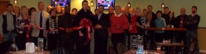 Shown at the Henderson-Vance Chamber of Commerce ribbon cutting for Seven Springs Delight Restaurant & Bar are, (front row from left): Tim Hester, Vice President PRIM Development & Residential Rentals; Chamber Board members Susan Rogers, Chick-fil-et; Chamber President John Barnes; Chamber Board member Jenny Hester, PRIM Development & Residential Rentals; Vance County Board of Commissioners Chair Archie Taylor; Dewey Petree, General Manager; Joe Schwartz, Owner; City Council and Mayor Pro-Tem Mike Rainey, City Tire; City Council member Sara Coffey, Coffeys Bail Bonds; (back row from left): Sheri Jones, HVCC Communications Coordinator; Elaine Jenkins, Customer Service Representative Fidelity Bank; Stuart Litvin, Economic Development Commission; Mike Garrett, Broker Coldwell Banker; Karen Stainback, Broker Coldwell Banker; Mary Lee Garrett; Patsy Rivers, Branch Manager Fidelity Bank; Al Rivers, Broker Coldwell Banker; Rick Edwards, Rick Edwards Electric; Warren Nelms, Quick Print; Chamber Ambassador Michael Bobbitt; Wayne Stainback, Variety Wholesalers, Inc.; Chamber Ambassador Pam Norwood, Magnolia Management; Clareese Moss, Shortcakes; Brad Johnson, Premier Chiropractic; Debbie Kinton, Consolidated Marketing; Kevin Bullock, WIZS Radio; Jeanie Nelms, Quick Print; Wayne Kinton, Consolidated Marketing; Bradley Edwards, Consolidated Marketing and other Chamber Businesses (Not Pictured but attended): Melanie Mann, HVCC Office Manager; Annette Roberson, HVCC Membership Director; Chamber Ambassador Julia Langston, Henderson Family YMCA; Chamber Ambassador Sandra Wilkerson, Charles Boyd Chevrolet-Cadillac-Buick-GMC