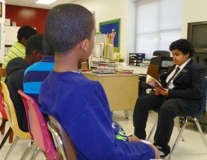 Elijah Hawkins, a sixth grader at Eaton-Johnson Middle School, is shown as he reads to a class at the school during one of his twice weekly reading sessions.