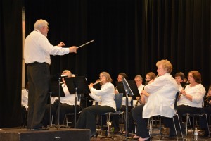 Alexander “Bob” Salzmann of Boydton, Va., serves as guest conductor as the Vance-Granville Community Band plays his own arrangement of Grieg’s “Elegiac Melody.” (VGCC photo)