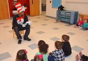 The “Cat in the Hat” reads the Dr. Seuss book in which he features prominently to children at the VGCC Main Campus Child Care Center. (VGCC Photo)