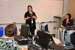 Marianne Durling of Granville Health System speaks to VGCC students, as instructor Hollie Garrett (seated at right) listens. (VGCC photo)