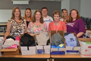 From left, Volunteer Services Director Andrea Bullock, Director of Environmental Services Debbie Carriere, Volunteer Services coordinator Lisa Slaughter and Linen Supervisor Kenneth Green, all from Murdoch Developmental Center, gratefully accept the contributions at VGCC’s South Campus from members of the college’s Sustainability Outreach Subcommittee: Geraldine Cash (South Campus administrative assistant), Gina Brewer (administrative assistant for Continuing Education) and Brandy Bowling (Biology instructor). (VGCC photo)