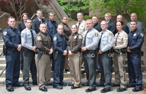 On front row, from left, VGCC Basic Law Enforcement Training Class 100 graduates Jason Lee Grainger, Bronson Douglas Murphy, Matthew Scott Craft, Brittany Lauren Strother, Katherine Leigh Keville, Ryan Hulett Woodlief, Joshua Adam Bailey, Leigh Hester and Daniel Scott Watson; on back row, from left, VGCC law enforcement training coordinator Andrea Ferguson, graduates Kenneth William Fitzsimmons, Jr., Zeb Landon Robinson, Melinda Ann Hester, Tyler Brady Currin, Matthew Ryan Groves, Joshua Wayne Garrett, Mark Anthony Williamson and VGCC instructor Glen Boyd. (VGCC Photo)