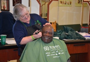 VGCC student George Bridges already had a shaved head, but he got a trim from VGCC Cosmetology instructor Nancy Jackson to support the cause. (VGCC photo)