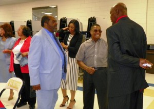 Gregory talks with Wil McLean, executive director of Human Resources and Finance for Vance County Schools, center, and Jerome Watson, a retired assistant principal from Vance County Schools.