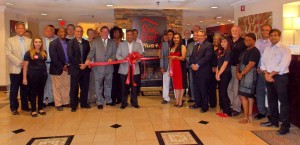 Shown at the Henderson-Vance Chamber of Commerce ribbon cutting for Red Roof Plus are, Antim and Maggie Patel; Ajay and Maggie Bhatt and staff; Red Roof corporate leaders; Archie Taylor, Vance County Commissioners Chairperson; HVCC President John Barnes; HVCC Board Member Stuart Litvin, Economic Development; Chamber Ambassador Michael Bobbitt; Chamber Ambassador Joan Robinson, Kittrell Job Corps; Chamber Ambassador Pam Norwood, Magnolia Management; Chamber Ambassador Kevin Bullock, WIZS 1450-AM; Stan Wolfenbarger, Staples; Edward & Lisa Zurick, eLi Screening & Consulting; Not Pictured: Wayne and Debbie Kinton, Consolidated Marketing; HVCC Office Manager, Melanie Mann; HVCC Director of Membership Services, Annette Roberson and other community business owners and leaders.