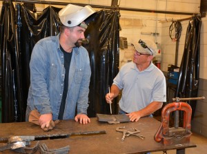 VGCC Welding student Kyle Vipperman (left) talks about a project with his instructor, program head Rusty Pace, on the college’s Main Campus. Vipperman intends to complete the new associate degree program in Welding. (VGCC photo)
