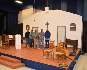 From left, students Keith A. Tunstall and Jonathan Calamaco, Carpentry program head/instructor Keith Tunstall, and students Brian Edwards and V'Randre Richardson stand on the set they constructed for the VGCC production of “Smoke on the Mountain.” (VGCC photo)