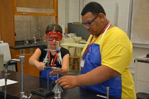 From left, Science Camp participants Savannah Jones of Creedmoor and Mar’kevious Cheatham of Oxford set up a chemistry experiment. (VGCC photo)