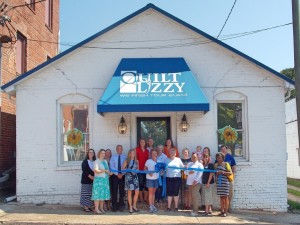Shown at the Henderson-Vance Chamber of Commerce of Commerce ribbon cutting for Quilt Lizzy are, Susan Harris, owner/operator and her staff; Warrenton city and county officials; HVCC President, John Barnes; HVCC Board of Directors Chairperson Tonya Evans, Duke Energy; HVCC Board Member Kim Jordan, CCB; Chamber Ambassador Katie Bloom, CCB; Chamber Ambassador Val Short, Triangle North Healthcare Foundation; HVCC Work First Coordinator, Vanessa Jones; HVCC Office Manager, Melanie Mann; Jeannie Elizabeth Rose; NOT PICTURED: John Charles Rose, WIZS 1450 AM; HVCC Membership Director, Annette Roberson